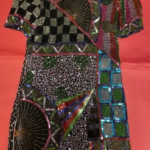 Beautiful full sequin party dress. Knee length.